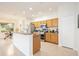 Bright kitchen boasts granite countertops and wood cabinets at 4405 Lenox Blvd, Venice, FL 34293
