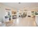 Open living room with tile floors and neutral decor at 4405 Lenox Blvd, Venice, FL 34293