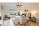 Relaxing main bedroom with a ceiling fan and stylish decor at 4405 Lenox Blvd, Venice, FL 34293