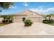 Two-car garage and attractive landscaping at 4405 Lenox Blvd, Venice, FL 34293