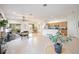 Open and bright living space with a view of the kitchen and dining area at 4405 Lenox Blvd, Venice, FL 34293