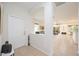 Bright and airy entryway with high ceilings and a view into the living area at 4405 Lenox Blvd, Venice, FL 34293