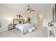Spacious main bedroom with ceiling fan and ensuite bathroom access at 4405 Lenox Blvd, Venice, FL 34293