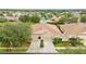 Property with two-car garage and community pool view at 4405 Lenox Blvd, Venice, FL 34293