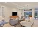 Living room with neutral color palette, comfy seating and large TV at 7962 Tybee Ct, University Park, FL 34201