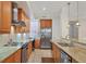 Stainless steel appliances and granite counters in this kitchen at 7962 Tybee Ct, University Park, FL 34201