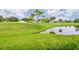 Scenic view of the lush golf course and pond at 429 Cerromar Ln # 353, Venice, FL 34293