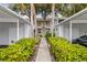 Front view of the building with walkway and landscaping at 429 Cerromar Ln # 353, Venice, FL 34293