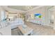Spacious living room with sectional sofa and view of kitchen at 2942 Trustee Ave, Sarasota, FL 34243