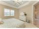 Bright bedroom with a king-size bed, dresser, and view to another room at 2942 Trustee Ave, Sarasota, FL 34243