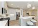 Modern kitchen with stainless steel appliances and white cabinetry at 2942 Trustee Ave, Sarasota, FL 34243