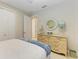 Bright bedroom with double doors and built-in dresser at 2942 Trustee Ave, Sarasota, FL 34243