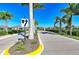 Community entrance with lush landscaping and palm trees at 2942 Trustee Ave, Sarasota, FL 34243