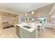 Open concept kitchen with island and view to living room at 2942 Trustee Ave, Sarasota, FL 34243