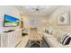 Cozy den featuring a comfortable sofa and built-in shelving at 2942 Trustee Ave, Sarasota, FL 34243