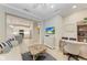 Open living space with a view into the kitchen and a workspace at 2942 Trustee Ave, Sarasota, FL 34243