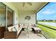Spacious screened-in porch with wicker furniture at 2942 Trustee Ave, Sarasota, FL 34243