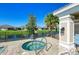 Community hot tub with surrounding patio and landscaping at 2942 Trustee Ave, Sarasota, FL 34243