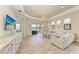 Spacious living room with large sectional sofa and water view at 2942 Trustee Ave, Sarasota, FL 34243