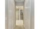 View down a hallway to a bathroom with glass shower at 2942 Trustee Ave, Sarasota, FL 34243
