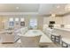 Bright dining room with white table and chairs, open to kitchen at 2942 Trustee Ave, Sarasota, FL 34243