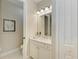Guest bathroom with single vanity and toilet at 2942 Trustee Ave, Sarasota, FL 34243