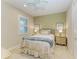 Guest bedroom with a full-size bed and tranquil decor at 2942 Trustee Ave, Sarasota, FL 34243