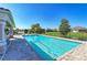 Relaxing community pool with plenty of lounge chairs at 2942 Trustee Ave, Sarasota, FL 34243