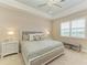 Spacious bedroom with a king-size bed, window shutters, and neutral color palette at 2942 Trustee Ave, Sarasota, FL 34243