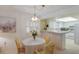 Dining area with kitchen and view into living room at 3500 El Conquistador Pkwy # 238, Bradenton, FL 34210