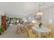 Spacious living room with view to screened-in patio and golf course at 3500 El Conquistador Pkwy # 238, Bradenton, FL 34210