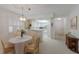 Bright dining area with view into kitchen and hallway at 3500 El Conquistador Pkwy # 238, Bradenton, FL 34210