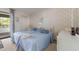 Bedroom with twin beds and access to a private balcony at 3500 El Conquistador Pkwy # 238, Bradenton, FL 34210