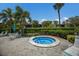 Community hot tub with surrounding lounge chairs at 3500 El Conquistador Pkwy # 238, Bradenton, FL 34210