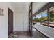 Condo entryway with private door and screened-in porch at 3500 El Conquistador Pkwy # 238, Bradenton, FL 34210