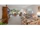 Living room with patio access and golf course view at 3500 El Conquistador Pkwy # 238, Bradenton, FL 34210