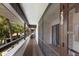 Building hallway with screened-in walkways and private condo entrances at 3500 El Conquistador Pkwy # 238, Bradenton, FL 34210
