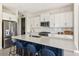 Modern kitchen with stainless steel appliances and a large island at 2803 Butterfly Jasmine Trl, Sarasota, FL 34240