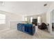 Spacious bonus room with comfortable seating and a large TV at 2803 Butterfly Jasmine Trl, Sarasota, FL 34240