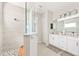 Spa-like bathroom with walk-in shower and double vanity at 2803 Butterfly Jasmine Trl, Sarasota, FL 34240