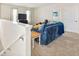 Bright bonus room with a comfortable couch and TV at 2803 Butterfly Jasmine Trl, Sarasota, FL 34240