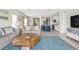 Open living room with a view of kitchen and dining area at 2803 Butterfly Jasmine Trl, Sarasota, FL 34240