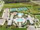 Resort-style community pool, tennis courts, playground, and clubhouse at 2803 Butterfly Jasmine Trl, Sarasota, FL 34240