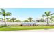 Windward community entrance with palm trees and landscaping at 2803 Butterfly Jasmine Trl, Sarasota, FL 34240