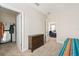 Bright bedroom with a dresser and access to a walk-in closet at 2803 Butterfly Jasmine Trl, Sarasota, FL 34240