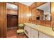Bathroom with a vanity, mirror, and built-in shelving at 3410 Spanish Oak Ter, Sarasota, FL 34237
