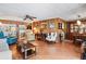 Spacious living room with wood-look floors and ample seating at 3410 Spanish Oak Ter, Sarasota, FL 34237
