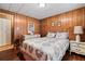 Cozy bedroom with wood floors and a lovely quilt at 3410 Spanish Oak Ter, Sarasota, FL 34237