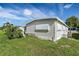 Single-wide manufactured home with a well-maintained yard at 3410 Spanish Oak Ter, Sarasota, FL 34237