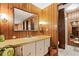 Clean bathroom with a vanity and adjacent closet at 3410 Spanish Oak Ter, Sarasota, FL 34237